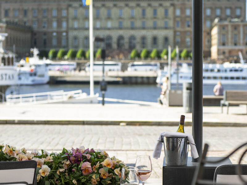 Toast and wine outside serving Lydmar Hotel stockholm the patio