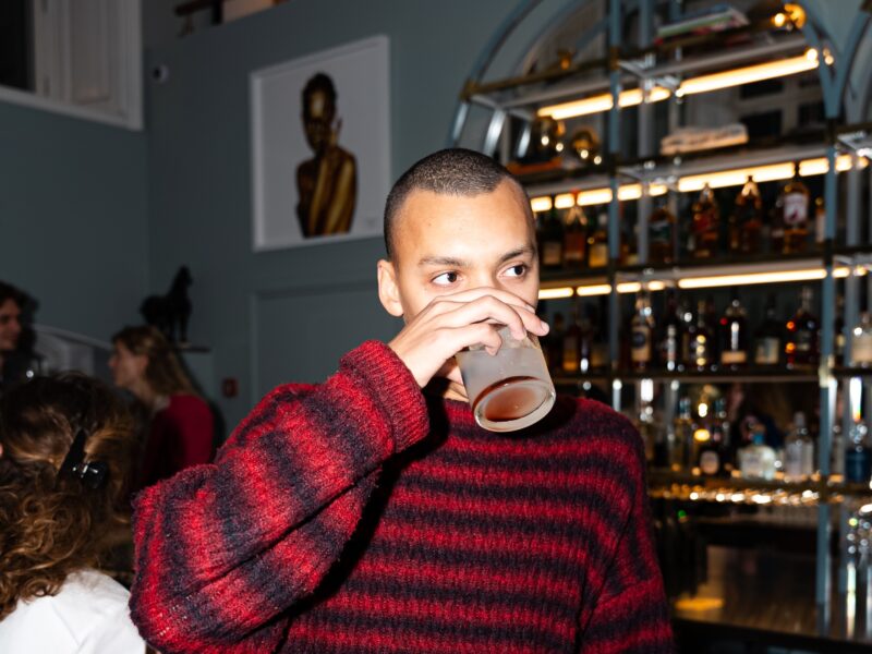 Man zipping on drink Lydmar Hotel stockholm the bar